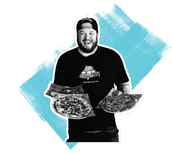 Photo of a MOD Squad Member smiling and holding pizzas.